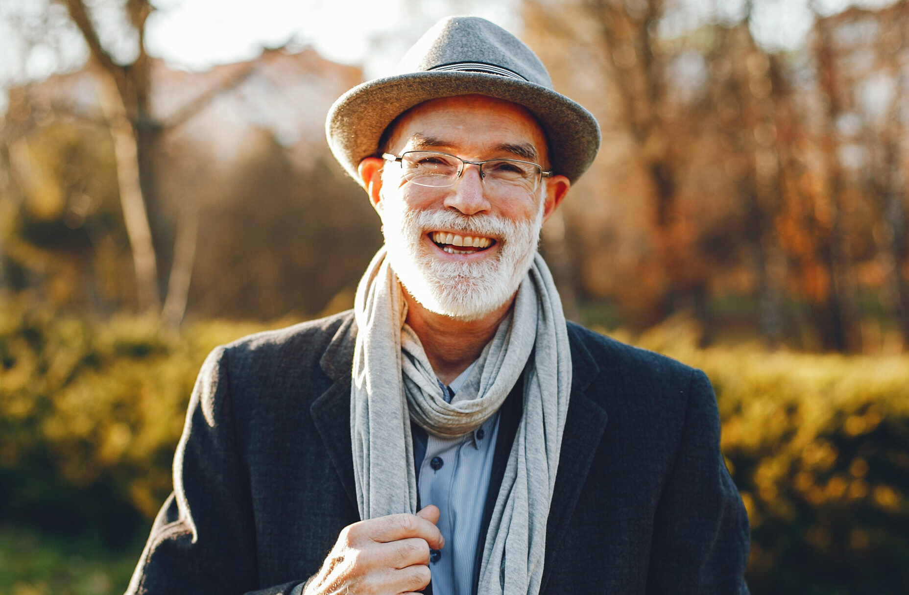 Elegant Old Man In A Sunny Autumn Park